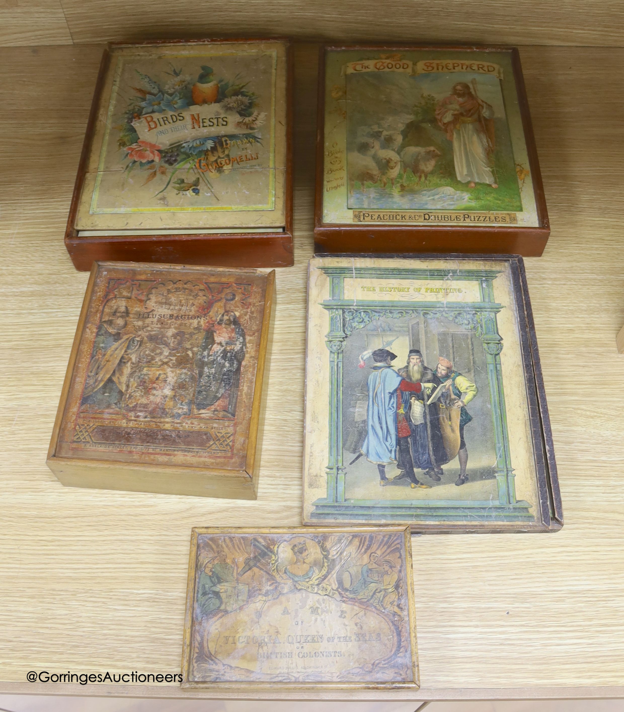 Five Edwardian boxed jigsaw puzzles, to include the history of printing, birds and their nests, biblical subjects, etc